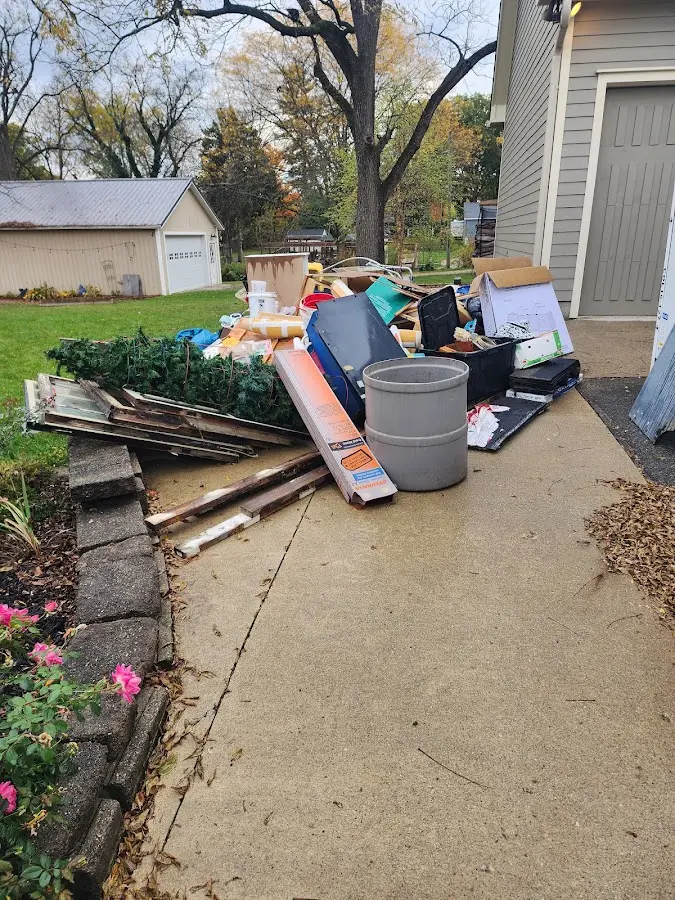 Dumpster being loaded with debris for 30 Yard Dumpster Rental in Hazel Dell